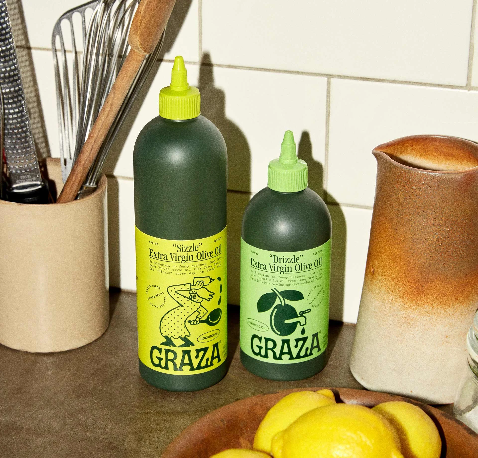 Green Graza olive oil bottles with Gander's identity photographed in a kitchen by Anisha Sisodia
